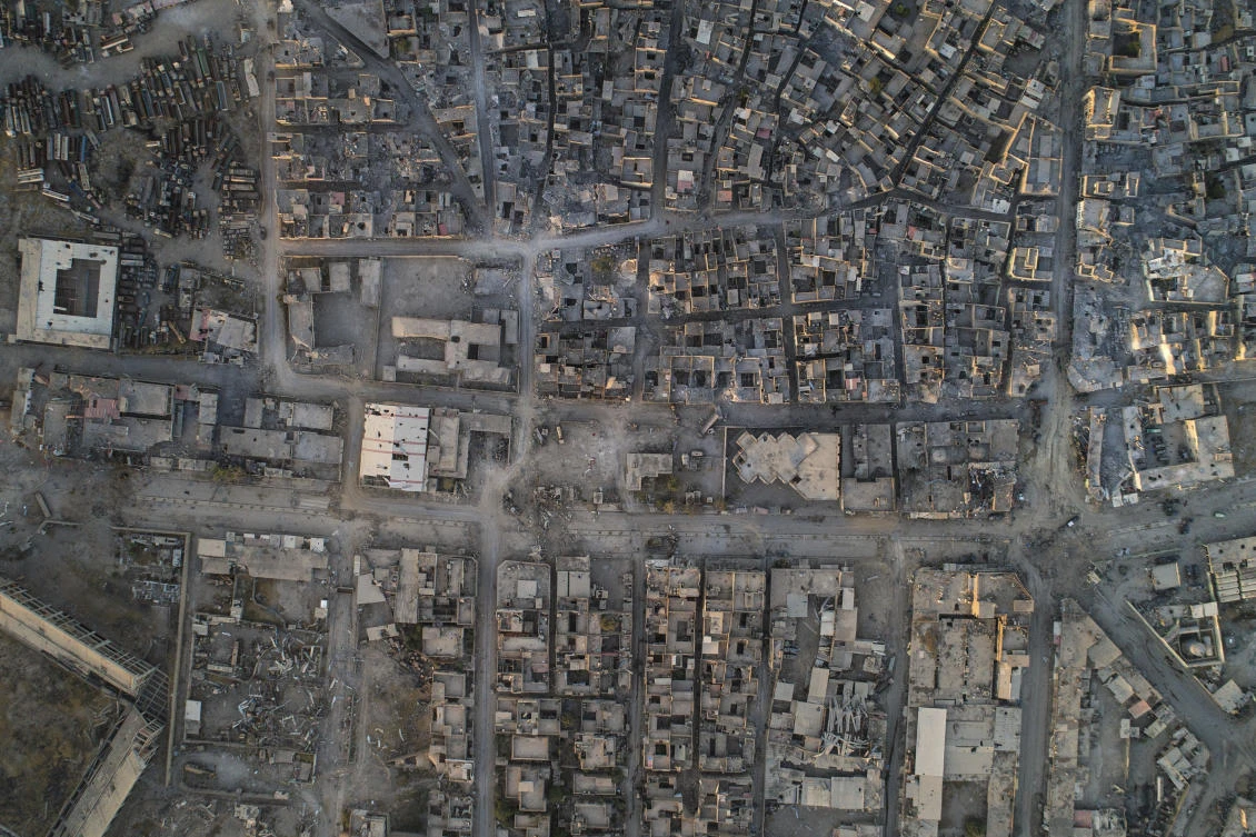 In this June 29, 2017 photo, an aerial view of damaged buildings in the Old City of Mosul, Iraq. Iraq’s U.S.-backed forces succeeded in wresting Mosul from the Islamic State group but at the cost of enormous destruction. The nearly 9-month fight culminated in a crescendo of devastation _ the blasting of the historic Old City to root out the militants’ final pockets. (AP Photo/Felipe Dana)