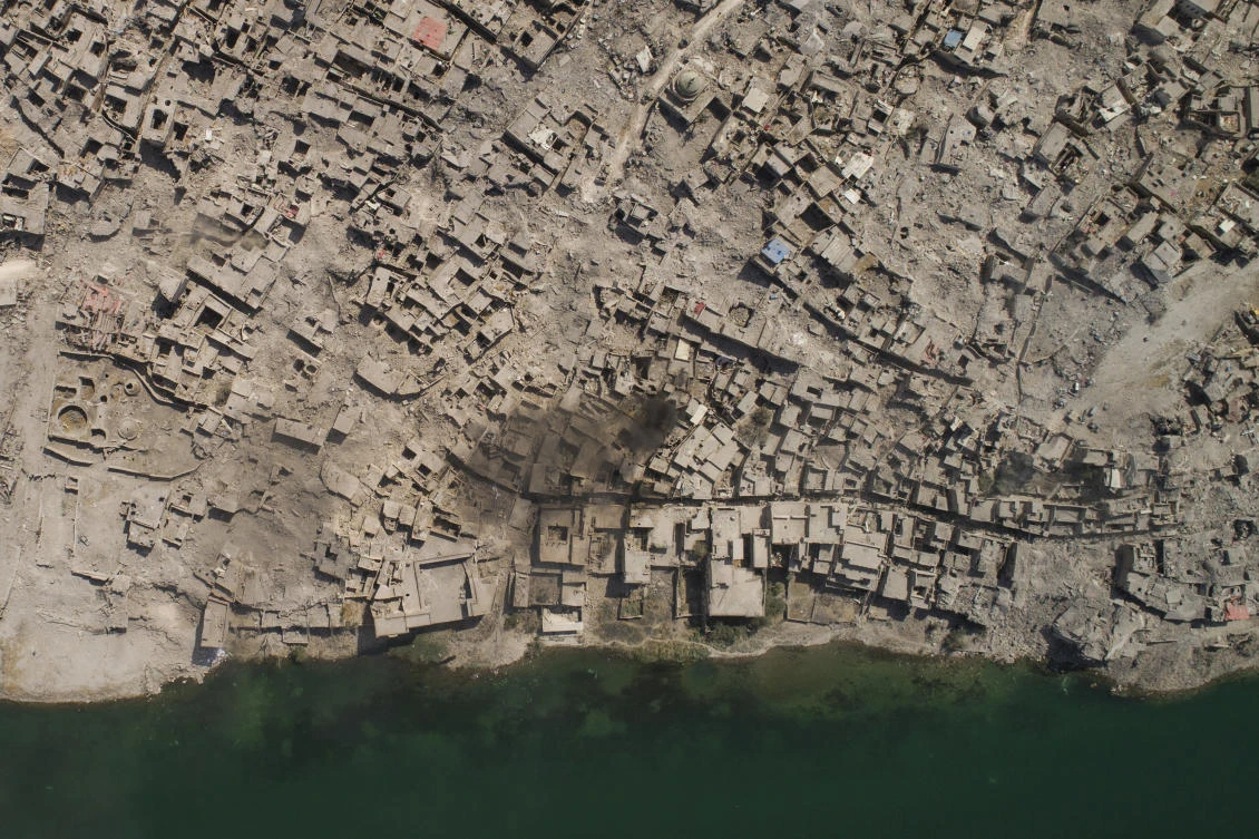 In this July 10, 2017 photo, an aerial view of the Tigris river and the Old City of Mosul, Iraq. Iraq’s U.S.-backed forces succeeded in wresting Mosul from the Islamic State group but at the cost of enormous destruction. The nearly 9-month fight culminated in a crescendo of devastation _ the blasting of the historic Old City to root out the militants’ final pockets. (AP Photo/Felipe Dana)