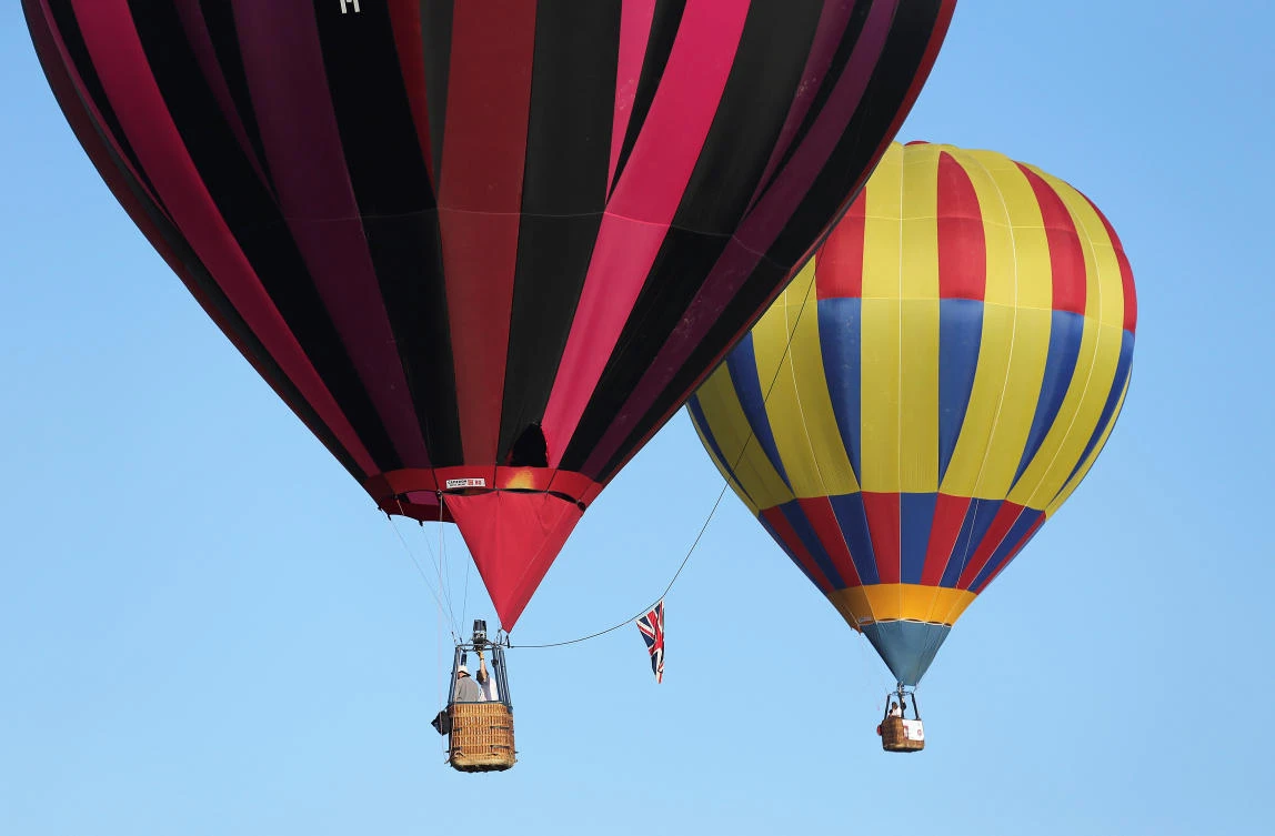 Hot air balloons fly during a hot air ballooning event in Todi, Italy, July 29, 2017. REUTERS/Alessandro Bianchi