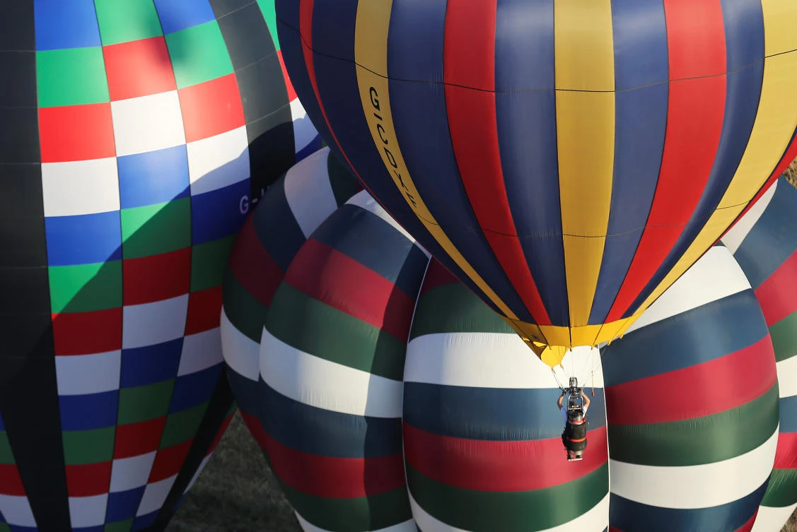 A hot air balloon flies during a hot air ballooning event in Todi, Italy, July 29, 2017. REUTERS/Alessandro Bianchi