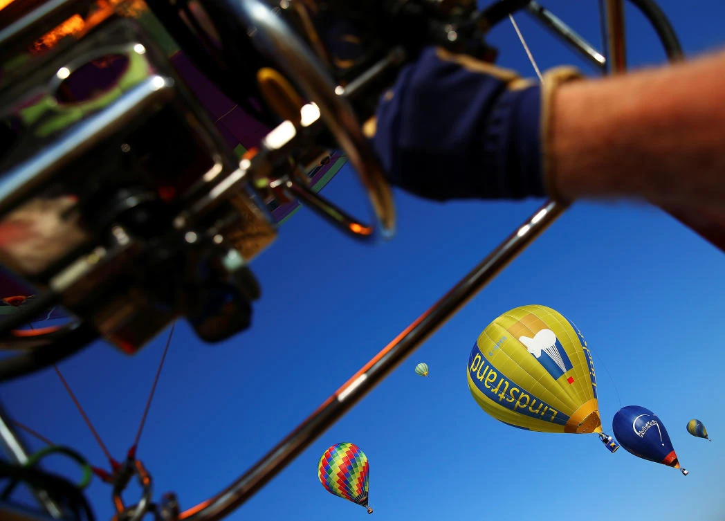 Hot air balloons fly during a hot air ballooning event in Todi, Italy, July 29, 2017. REUTERS/Alessandro Bianchi