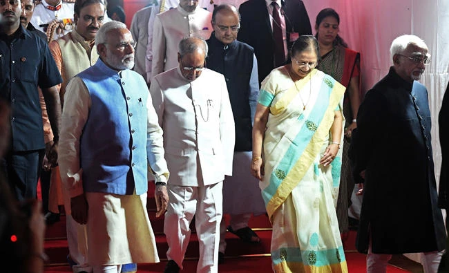 Indian President Pranab Mukherjee (C), Prime Minister Narendra Modi (2L), Parliament Speaker Sumitra Mahajan (2R)and Vice-President Hamid Ansari (R) arrive for a special session for the implementation of The Goods and Services Tax (GST) at Parliament House in New Delhi on Friday. (AFP / PRAKASH SINGH)