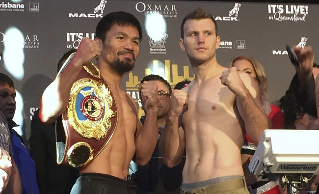 Manny Pacquiao, left, and Jeff Horn pose for a photo after weighing in Saturday in Brisbane, Australia. (AP Photo/John Pye)