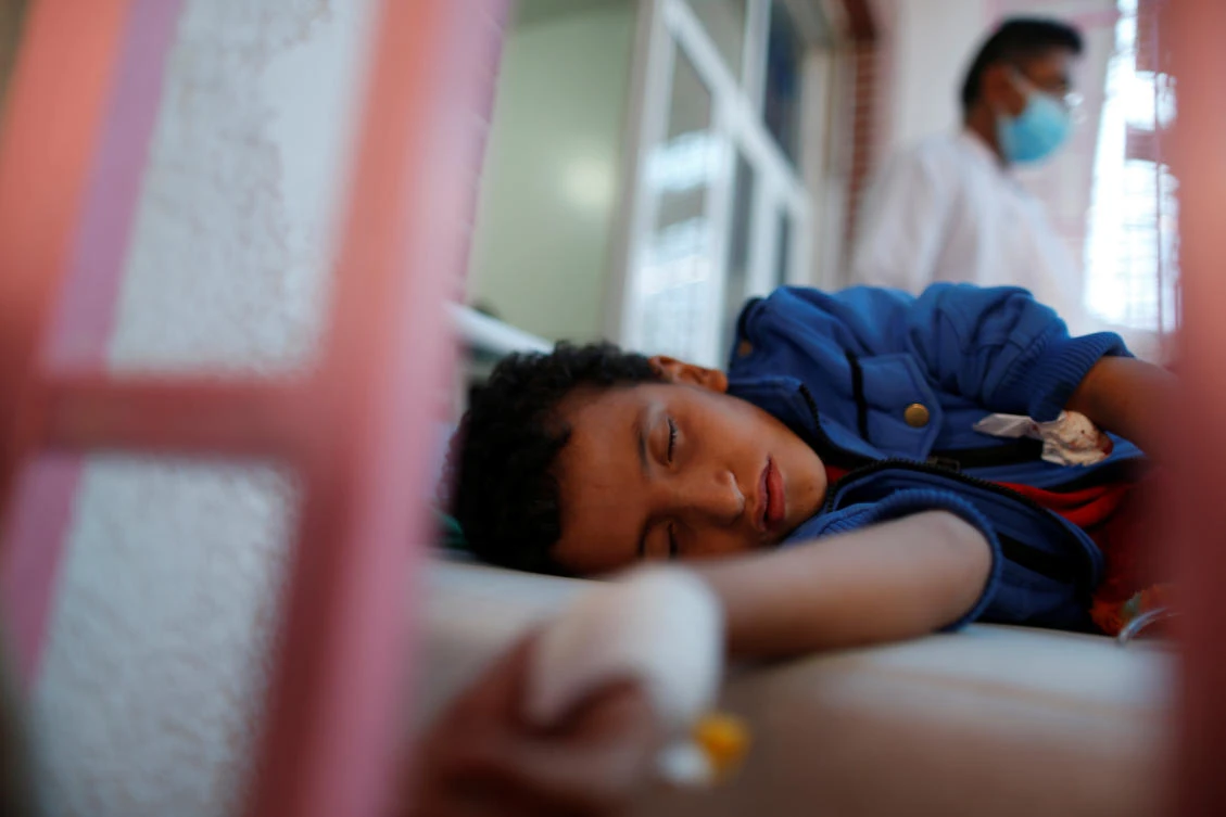 A boy lies on a bed at a cholera treatment center in Sanaa, Yemen. (REUTERS)