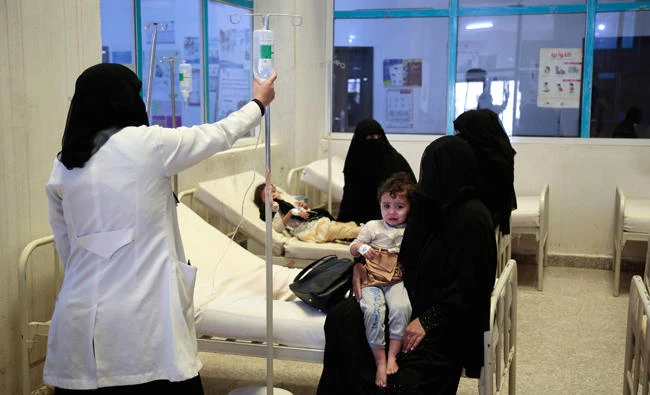People are treated for suspected cholera infections at a hospital in Sanaa, Yemen, on Saturday. (AP)