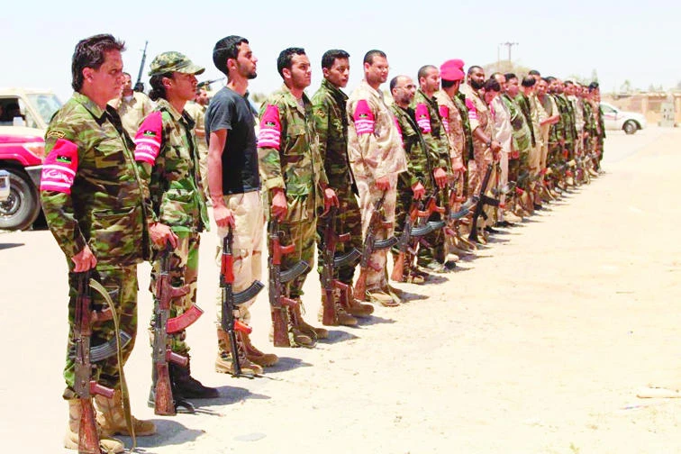 Army soldiers attend a funeral for militiamen killed in clashes earlier in this file picture. (Reuters)