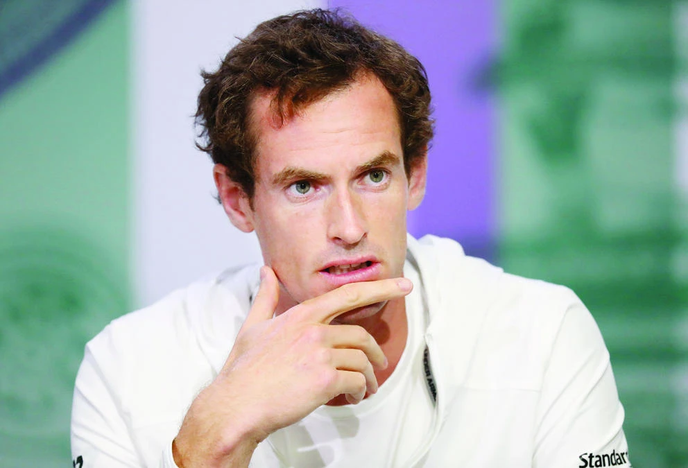 Britain's Andy Murray speaks at a press conference ahead of the Wimbledon Tennis Championships in London Sunday. Murray is the defending men's singles champion. (AP)
