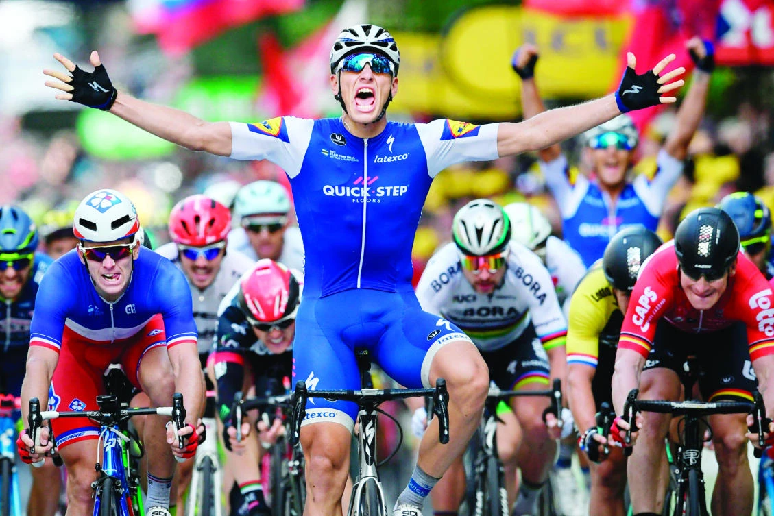 Germany's Marcel Kittel celebrates as he crosses the finish line ahead of France's Arnaud Demare, left, Slovakia's Peter Sagan, third right, and Germany's Andre Greipel, right, at the end of the 203.5 km second stage of the 104th edition of the Tour de France cycling race on Sunday between Dusseldorf, Germany and Liege, Belgium. (AFP)