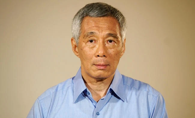 This handout from Singapore's Ministry of Communications and Information (MCI) taken and released on June 19, 2017 shows Singapore's Prime Minister Lee Hsien Loong making a statement at the Istana presidential palace in Singapore. (AFP)