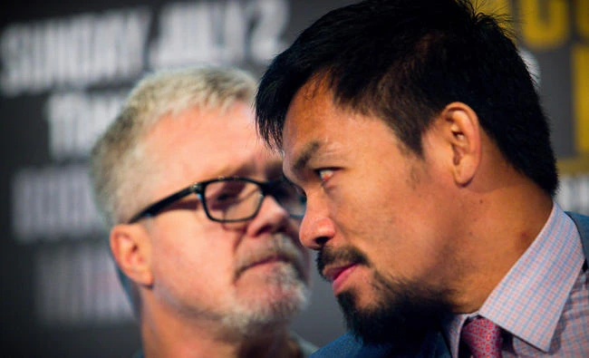 Philippine boxer Manny Pacquiao (R) and trainer Freddie Roach attend a press conference to promote Pacquiao's WBO Welterweight title fight against Australian challenger Jeff Horn at Suncorp Stadium in Brisbane on June 28, 2017. (AFP file photo)