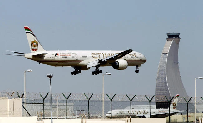 In this file photo, an Etihad Airways plane prepares to land at the Abu Dhabi airport in the United Arab Emirates. (AP)