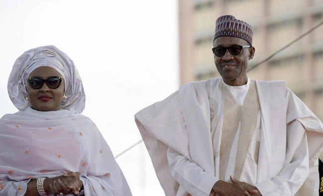 In this file photo, Nigerian President Mohammadu Buhari with his wife Aisha. The wife of ailing Nigerian President Muhammadu Buhari has left the country to visit him in London after first attending an African Union event. (AFP)