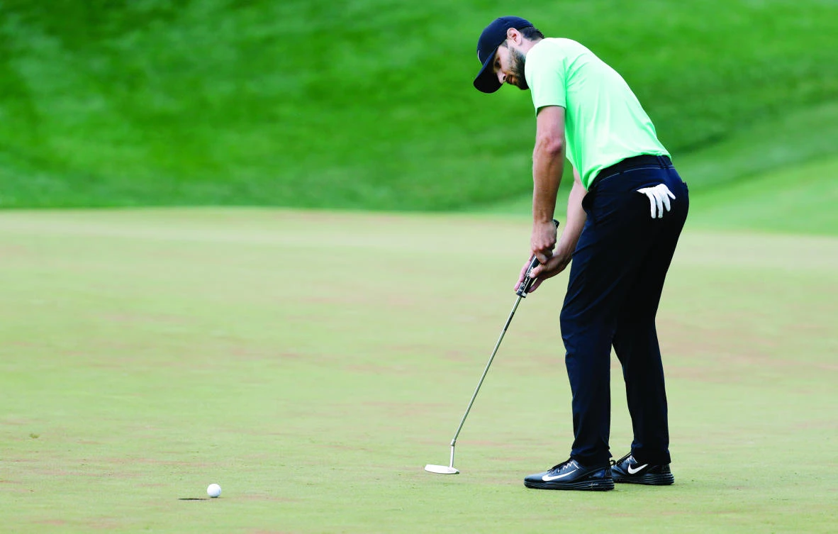Kyle Stanley sinks the winning putt on the 18th green of the playoff, during the Quicken Loans National golf tournament Sunday in Potomac, Md. (AP)
