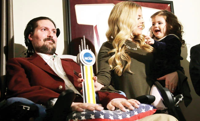Pete Frates, left, with his wife Julie, center, and daughter Lucy. (AP)