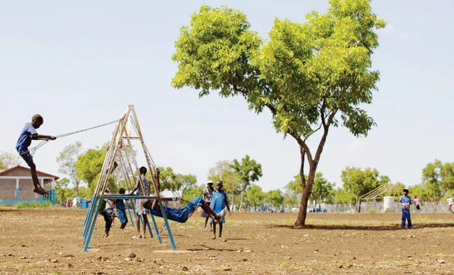 Unaccompanied children who travelled alone alone from South Sudan to the Ethiopian border, play on swings at the children friendly space of Plan International Nguenyyiel refuge camp in Gambela, Ethiopia, recently. (AFP)