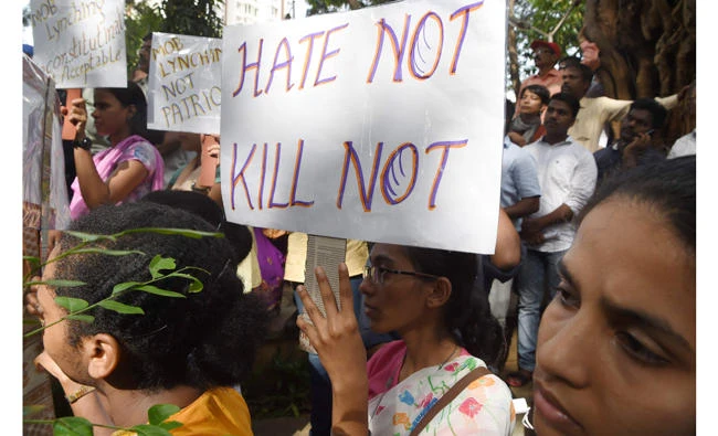 Indian demonstrators take part in a protest against a spate of murders targeting minorities under the pretext of protecting cows in Mumbai on July 3, 2017. (AFP)
