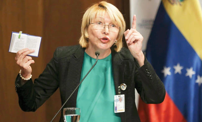 Venezuela's Chief Prosecutor Luisa Ortega holds a copy of the Venezuelan Constitution, as she speaks during a press conference in Caracas, in this
June 28 photo. (AP)