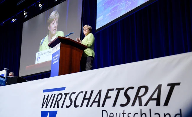 German Chancellor Angela Merkel speaks at a meeting of the Ecomomic Council (Wirtschaftsrat) of the German Christian Democrats Party (CDU) on June 27, 2017 in Berlin. The German DIHK Chambers of Commerce warned on Tuesday that US President Donald Trump’s protectionist approach to trade has the potential to ignite a trade war. (AFP / dpa / Rainer Jensen)