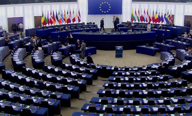 In this image taken from TV on Tuesday July 4, 2017 empty seats are seen at the European Parliament in Strasbourg France. (EBS Via AP)