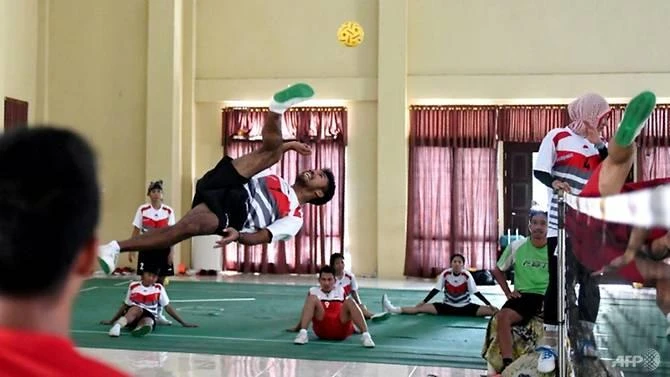 Indonesia's national sepak takraw team are "embedding" with an elite police unit on Sumatra island in the hope that military-style training will help them improve. (AFP)