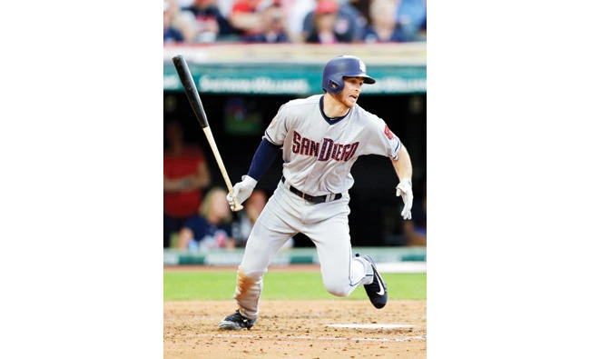 San Diego Padres’ Cory Spangenberg hits against Cleveland Indians starting pitcher Corey Kluber in the fifth inning of a baseball game Tuesday in Cleveland. Spangenberg hit into a fielder’s choice and was safe at first base. Hector Sanchez scored on the play for the winning run. (AP)