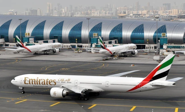 In this file photo, an Emirates plane taxis to a gate at Dubai International Airport in Dubai, United Arab Emirates. Dubai-based Emirates airlines says the U.S. has exempted it from a ban on laptops in airplane cabins. (AP Photo/Adam Schreck)