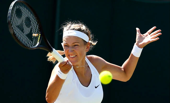 Victoria Azarenka of Belarus returns to Russia’s Elena Vesnina on day three at the Wimbledon Tennis Championships in London Wednesday. (AP)