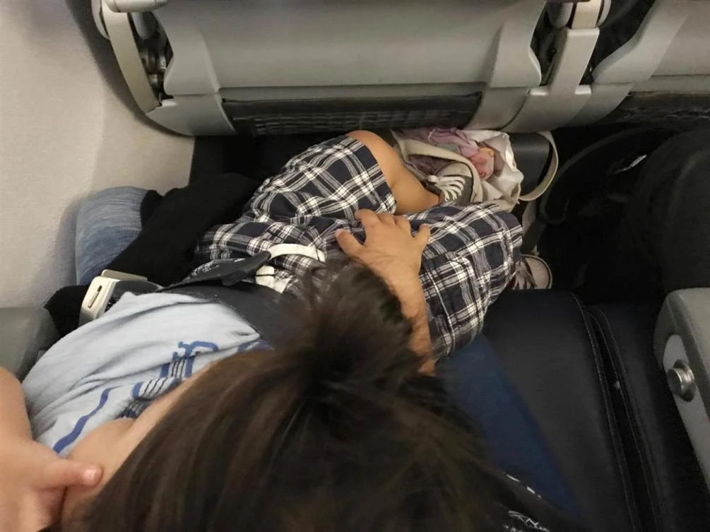 Shirley Yamauchi said United Airlines made her fly with her 27-month-old son in her lap on a flight from Houston to Boston, despite having purchased a seat for him. (Facebook: Shirley Yamauchi)