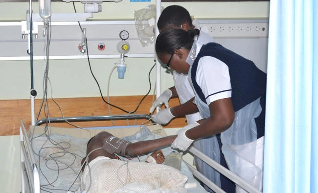 A nurse attends to an injured child in high care unit at the Kamuzu Central Hospital in Lilongwe, Malawi on Thursday. (AP)