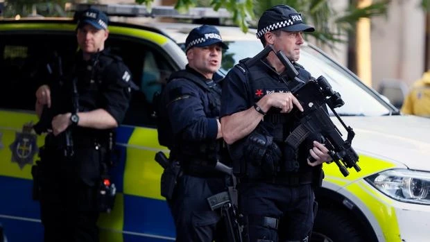 Armed police at the scene during a vigil in Albert Square, Manchester, the day after the suicide attack at an Ariana Grande concert that left 22 people dead. (AP)