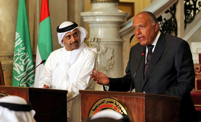 UAE Foreign Minister Abdullah bin Zayed Al-Nahyan listens as Egyptian Foreign Minister Sameh Shoukry speaks during a press conference after their meeting that discussed the diplomatic situation with Qatar, in Cairo on Wednesday. On Thursday, Shoukry spoke with Russian Foreign Minister Sergei Lavrov by telephone and reiterated the charge made by Egypt, Saudi Arabia, Bahrain and the UAE that Qatar was supporting terrorist groups.(REUTERS/Khaled Elfiqi/Pool)