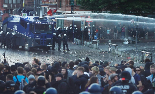 Riot police use water cannon during the "Welcome to Hell" rally against the G20 summit in Hamburg, northern Germany on Thursday. (AFP / Odd Andersen)