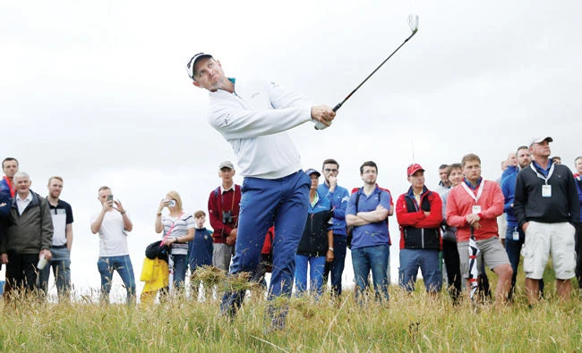 England's Justin Rose plays out of the rough during the first round Thursday in the Dubai Duty Free Irish Open at Portstewart, Northern Ireland. (Reuters)