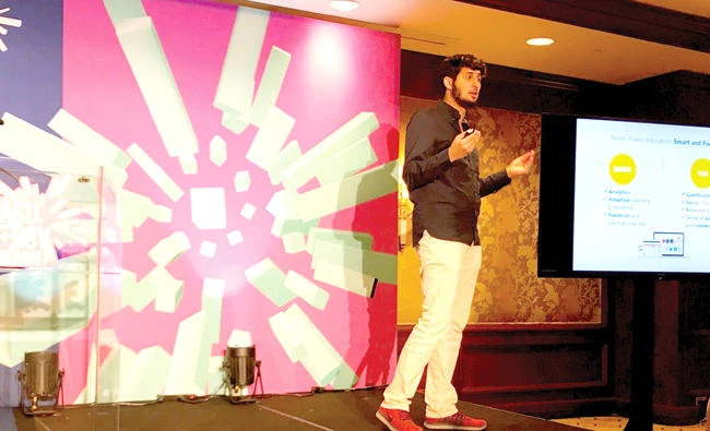 A Saudi youth conducts a demo at the investment in education technology (ed-tech) conference in Salt Lake City in Utah.
