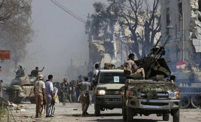 Members of Libyan National Army (LNA) gather after the liberation of Islamist militants' last stronghold in Benghazi, Libya, on Wednesday. (REUTERS/Esam Omran Al-Fetori)