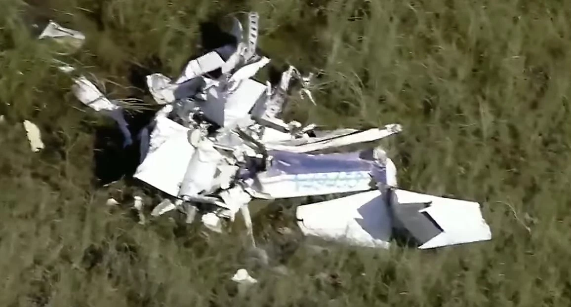 The debris of the single-engine Cessna aircraft (Screen grab from WPLG footage)