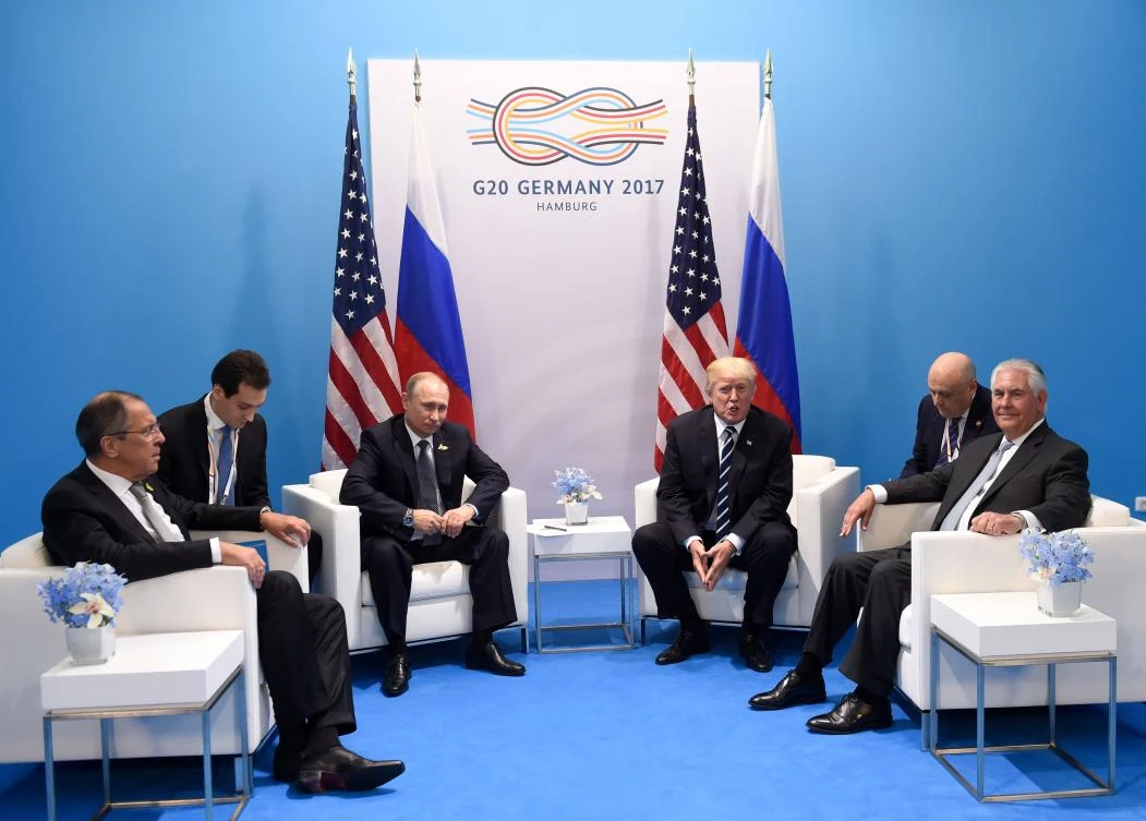US President Donald Trump (C-R) and Russia’s President Vladimir Putin (C-L) hold a meeting on the sidelines of the G20 Summit in Hamburg, Germany, on July 7, 2017. (AFP)