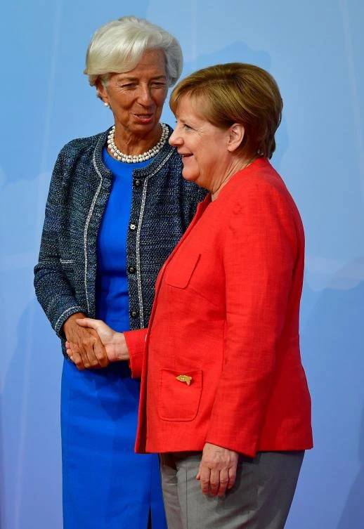 German Chancellor Angela Merkel welcomes Managing Director of the International Monetary Fund (IMF) Christine Lagarde. The IMF raised its growth forecast for Germany. (AFP)