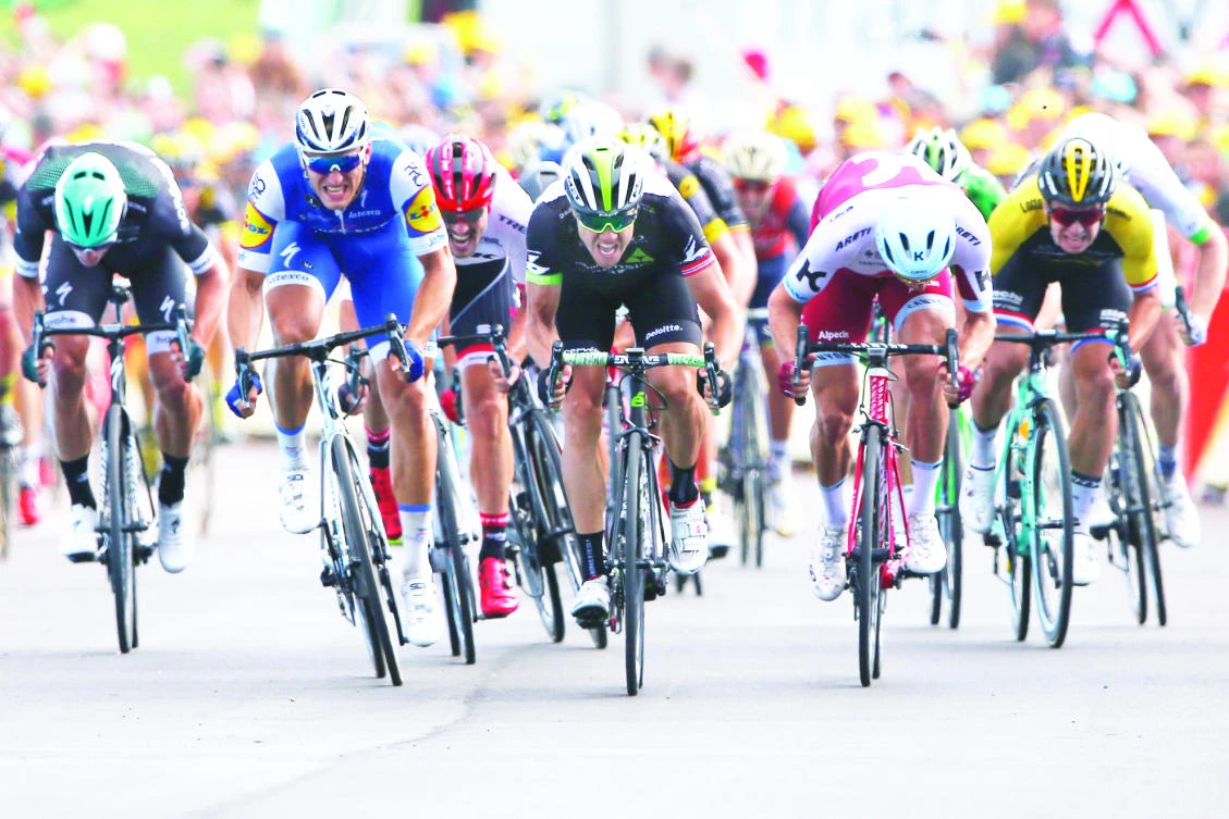 Marcel Kittel, second left, sprints to the finish line ahead of Edvald Boasson Hagen, center and second place, and Alexander Kristoff , second right, to win the seventh stage of the Tour de France cycling race with start in Troyes and finish in Nuits-Saint-Georges on Friday. (AP)
