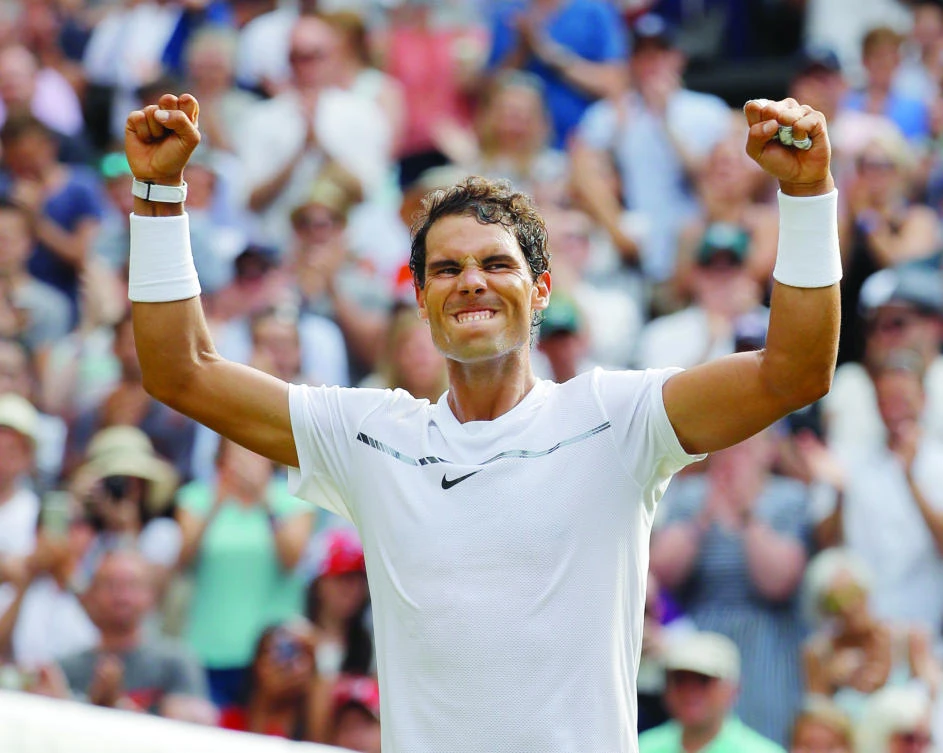 Rafael Nadal celebrates after winning against Karen Khachanov on day five at the Wimbledon Tennis Championships in London on Friday. (AP)