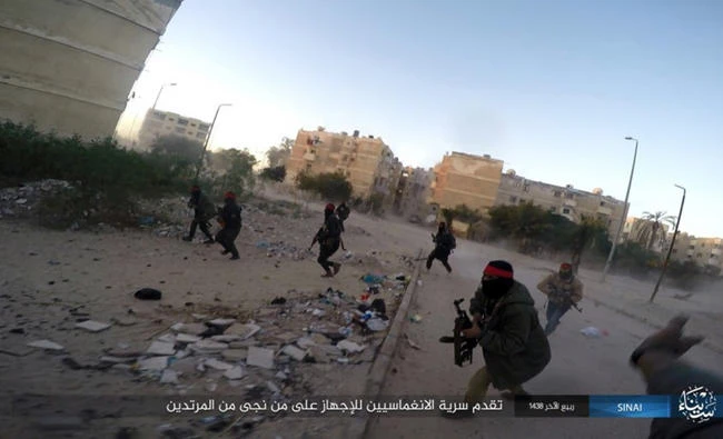 This photo posted on a file sharing website on Jan. 11, 2017, by the Daesh in Sinai, a militant organization, shows a deadly attack by militants on an Egyptian police checkpoint, in el-Arish, north Sinai, Egypt. (Islamic State Group in Sinai via AP, File )