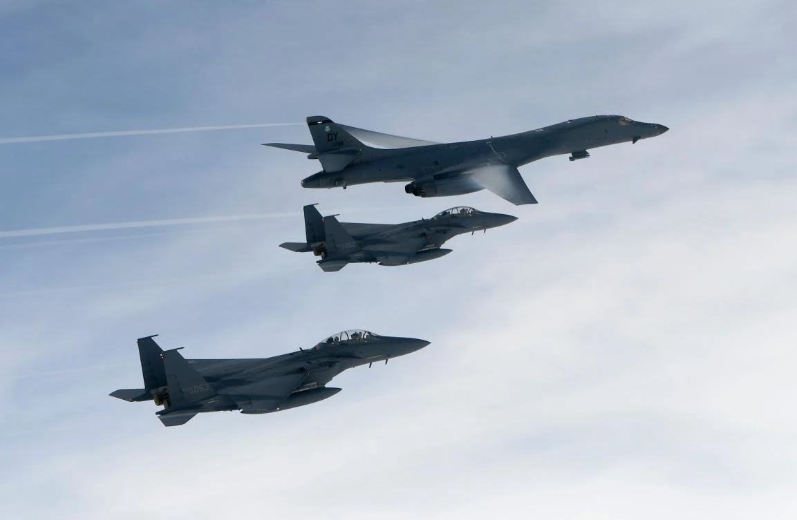 This handout photo taken on July 8, 2017 and provided by the South Korean Defence Ministry in Seoul shows the B-1B Lancer (top) flying over South Korea during a South Korea-US joint live fire drill conducted at a range in Yeongwol County. US bombers carried out a rare live fire drill in South Korea on July 8, flying close to the DMZ in a show of force after Pyongyang's latest missile test, the South's defence ministry said. (AFP)