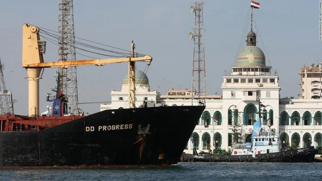 A cargo ship navigates past the Suez Canal Authority Building in Port Said, 180 kilometers northeast of Cairo, on November 24, 2008. (AFP)