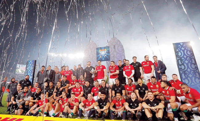 The Lions and New Zealand players pose after the match. (Reuters)
