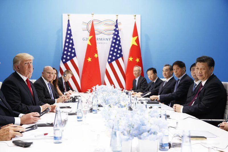 US president Donald Trump (L) meets with Chinese President Xi Jinping at the G20 Summit, Saturday, in Hamburg, Germany. (AP)