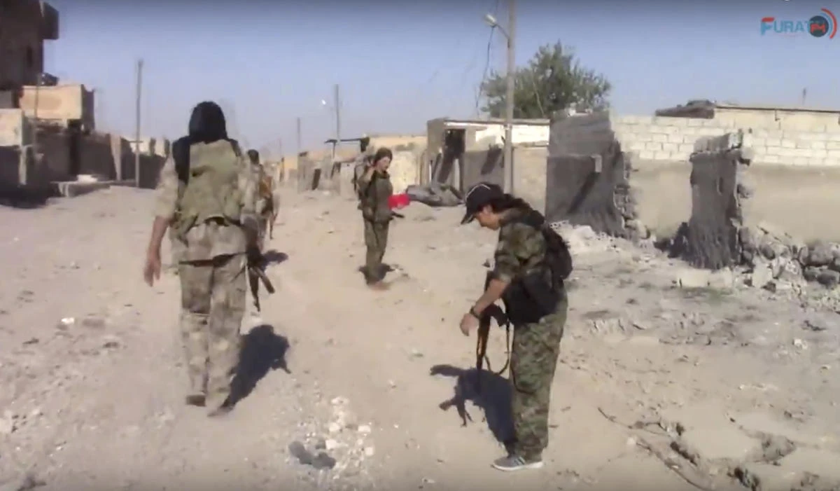This frame grab from video released Tuesday, July 4, 2017, and provided by Furat FM, a Syrian Kurdish activist-run media group, shows U.S.-backed Syrian Democratic Forces (SDF) fighters in the eastern side of Raqqa, Syria. The SDF forces have breached the wall around Raqqa's Old City, the U.S. military said Tuesday, marking a major advance in the weeks-old battle to drive Islamic State militants out of their self-declared capital. (AP)