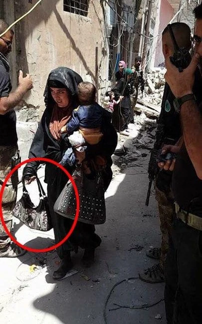 Chilling image captures woman suicide bomber clutching child, moments before death