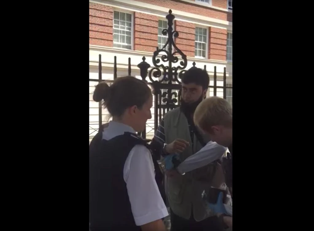 A Muslim man being searched by police in London for ‘wearing too many layers of clothes’ in the hot weather. (Photo courtesy: Video grab)