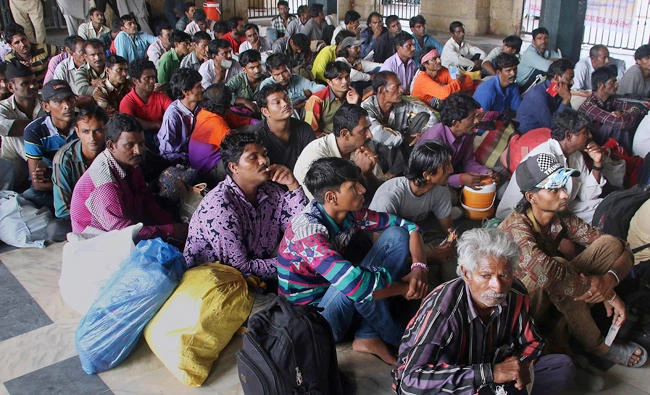 Indian fishermen wait to board a train following their release from the central jail in Karachi, Pakistan, on Sunday. (AP)