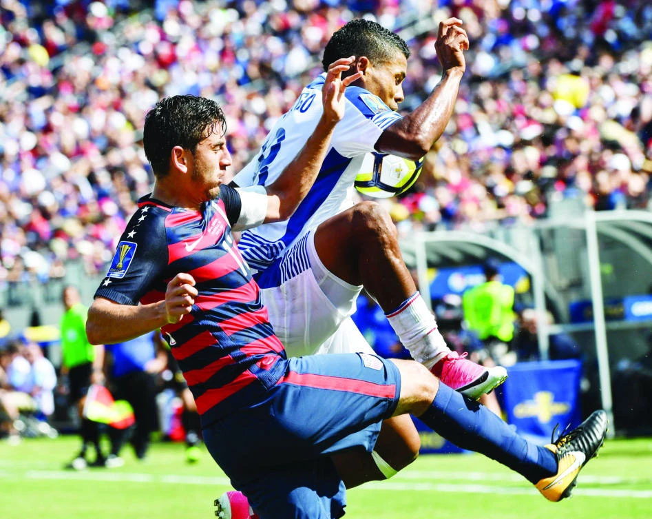 Alejandro Bedoya, left, of the US vies with Panama’s Miguel Camargo during a CONCACAF Gold Cup Group B match in Nashville, Tennessee, on Saturday. (AFP)